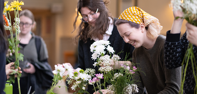 student with flowers