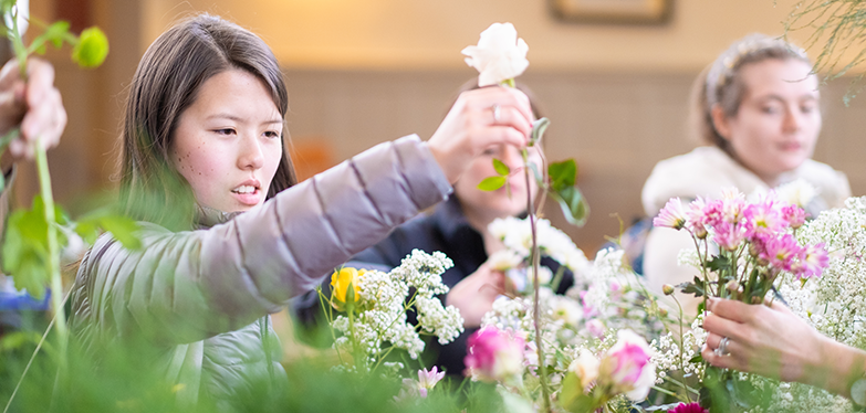 students with flowers